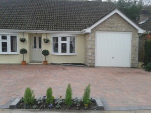 block paving driveway with flowers